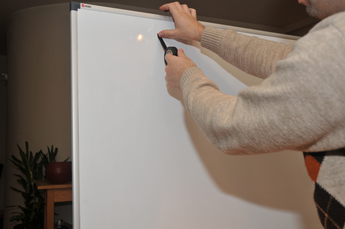 Press down tape with thumb Press down tape with thumb